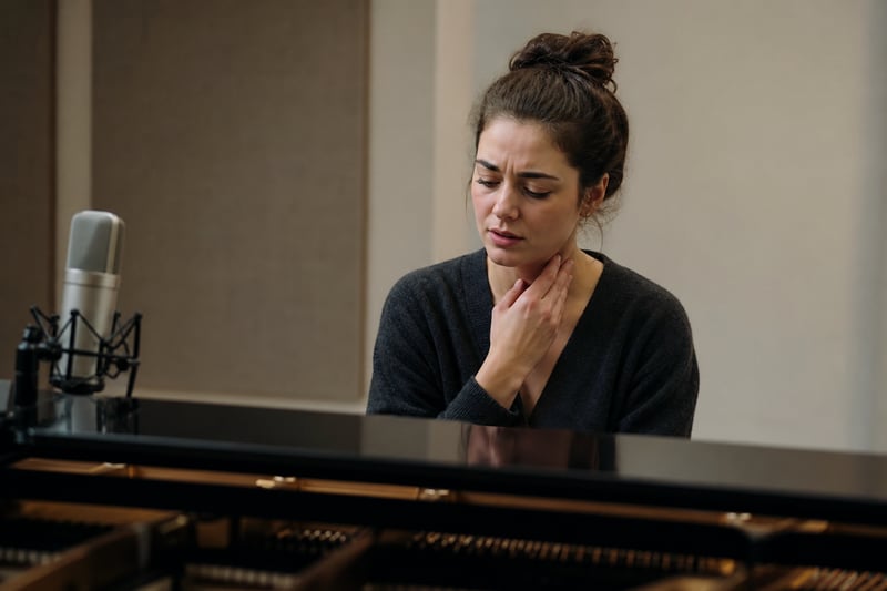 Singer Adjusting Vocal Strain in Clinical Practice Room