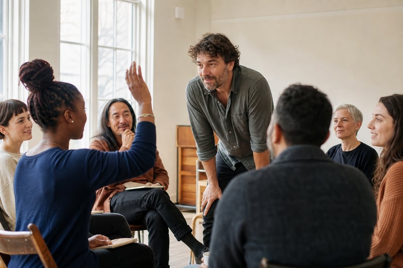 Singing Coach and Group in Studio Discussion