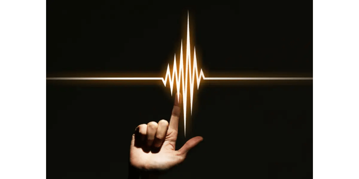 An illustration of a human hand capturing a glowing, vibrant golden audio waveform against a dark background, representing the high-pitched whistle register.