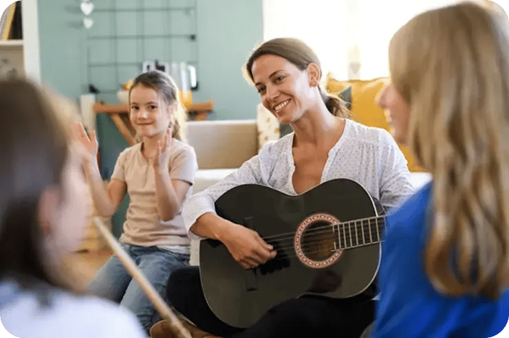 Adult woman smiling while practicing vocal exercises during an online adult singing lesson.