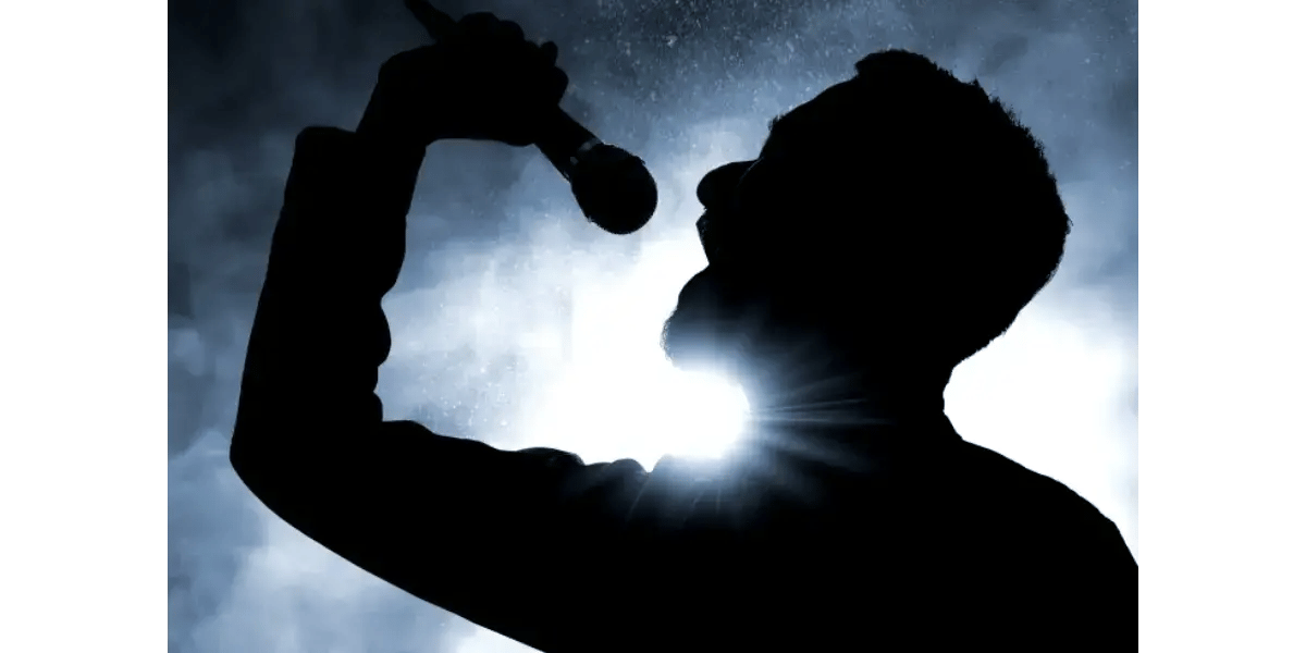 A silhouette of a singer with a glowing light in their throat, visualizing the concept of forced resonance and the singer's ring.