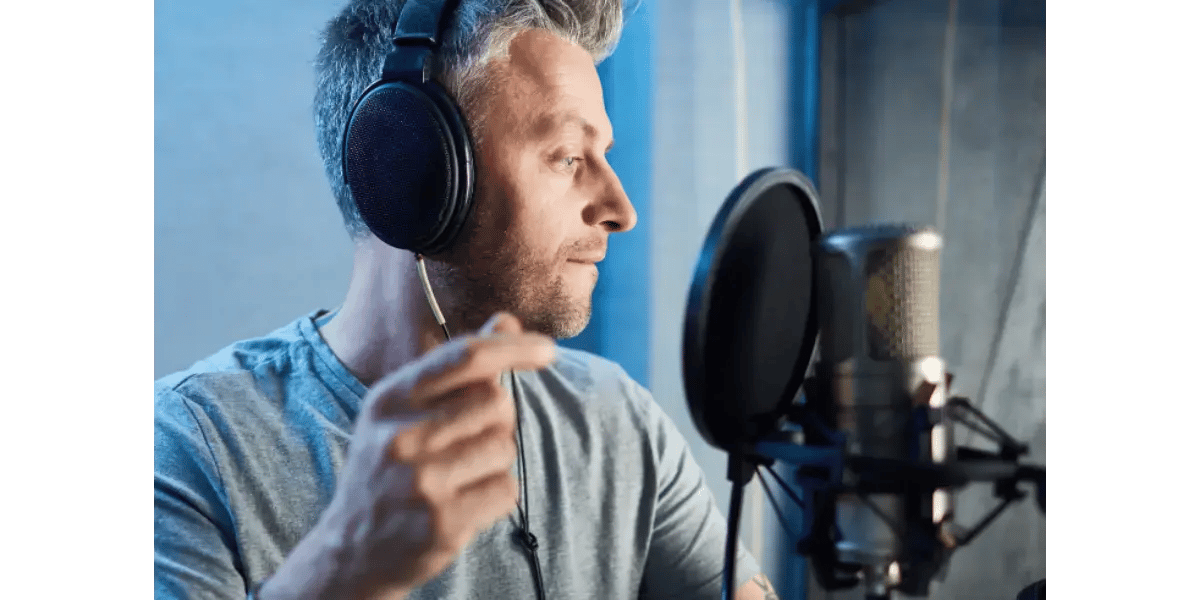A professional singer recording vocals in a studio, representing a career in the music industry.