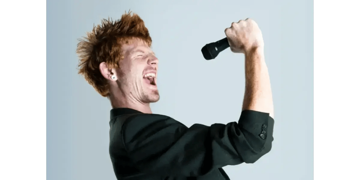 A person clenching their fist in frustration, representing the vocal fatigue caused by an unbalanced and heavy falsetto.