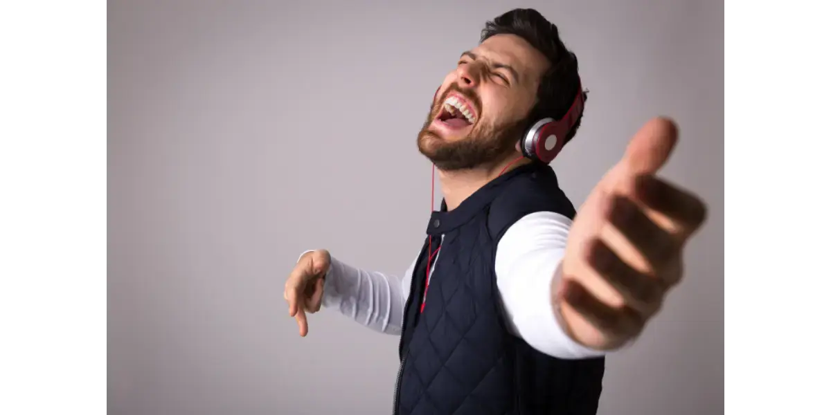 A singer demonstrating the physical tension and choking sensation often caused by an improperly high laryngeal position.